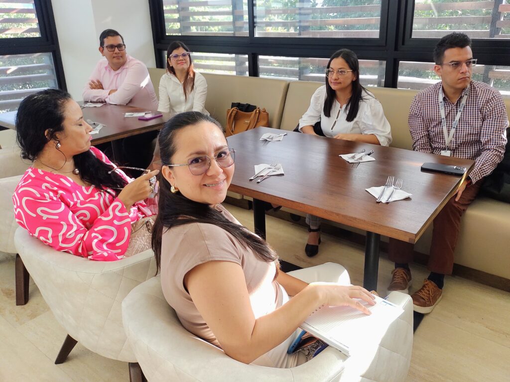 Representatives of the Health Services Provider Network listening to a presentation by Dr. Gonzalo Gómez, director of UISALUD.