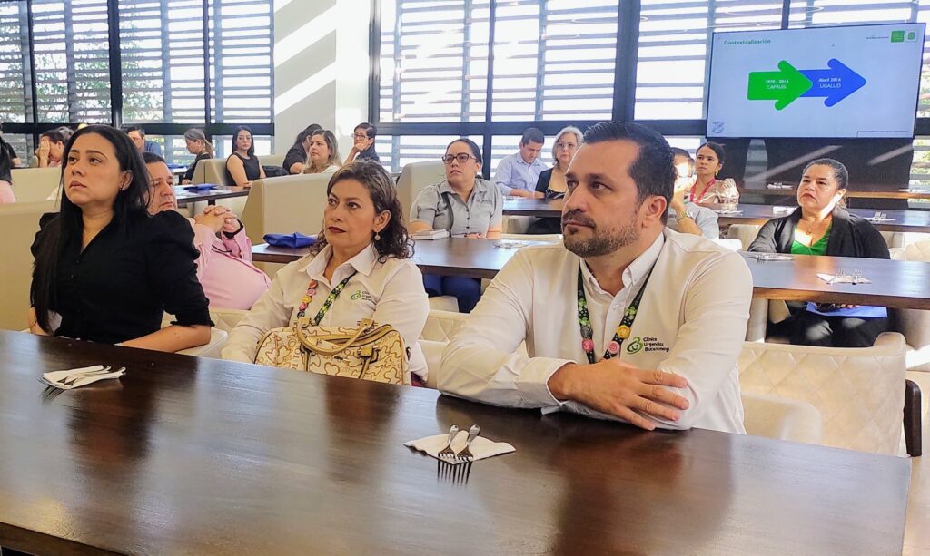 Representatives of the Health Services Provider Network listening to a presentation by Dr. Gonzalo Gómez, director of UISALUD.