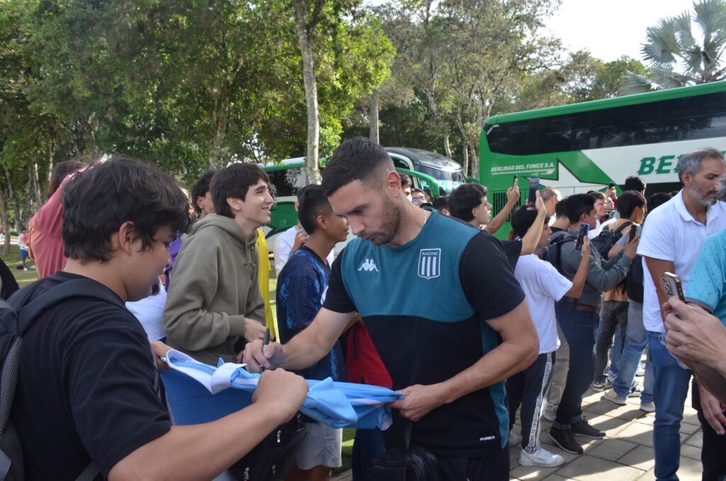 Image showing Maravilla Martínez signing a t-shirt.