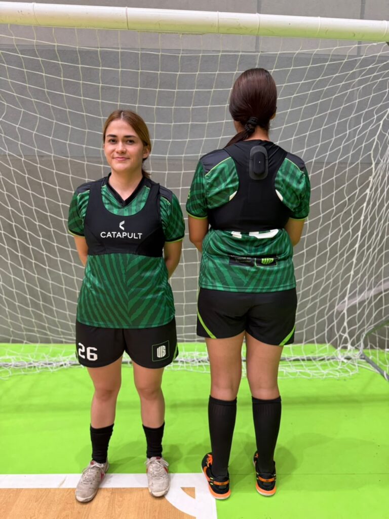 Women’s futsal players during training while using the device.